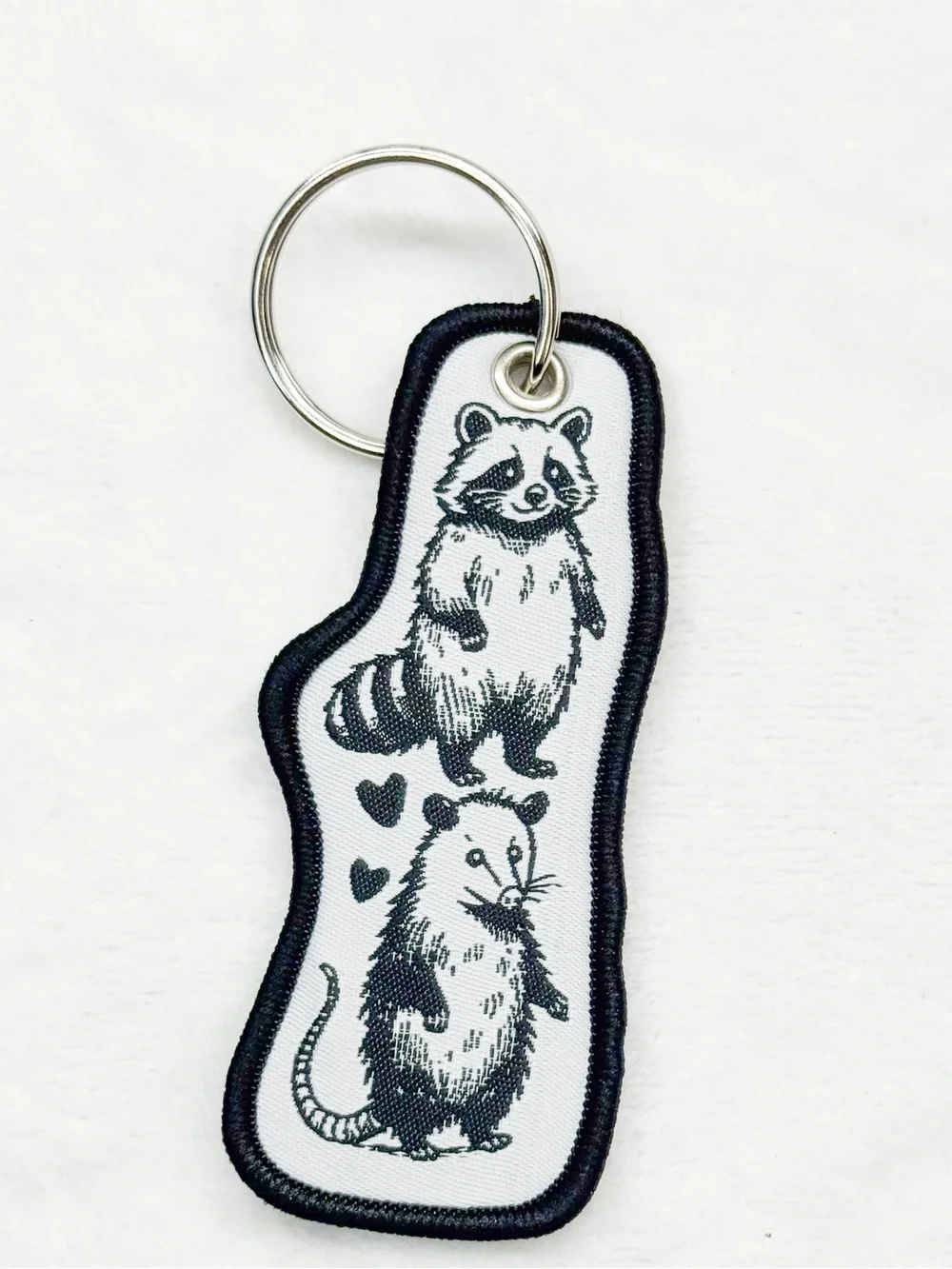 Raccoon & Possum “You’re Weird I’ll Keep You” Keychain